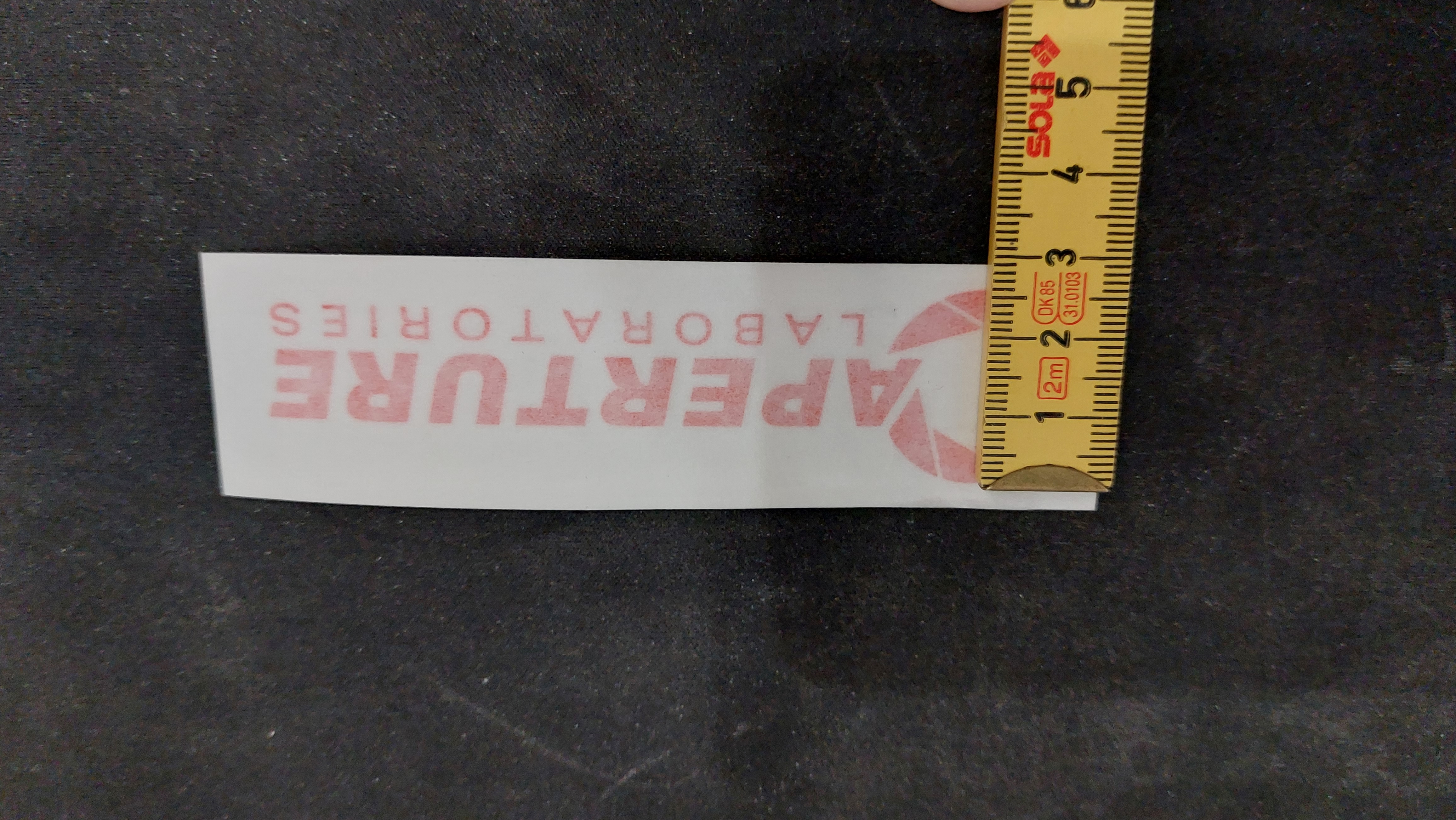 Unapplied logo sticker with centimeter stick