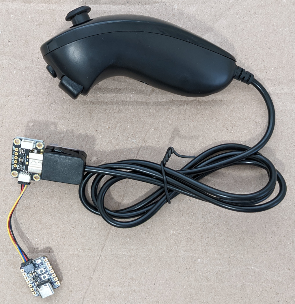 Photo of nunchuck connected to adapter and QT Py ESP32-S3